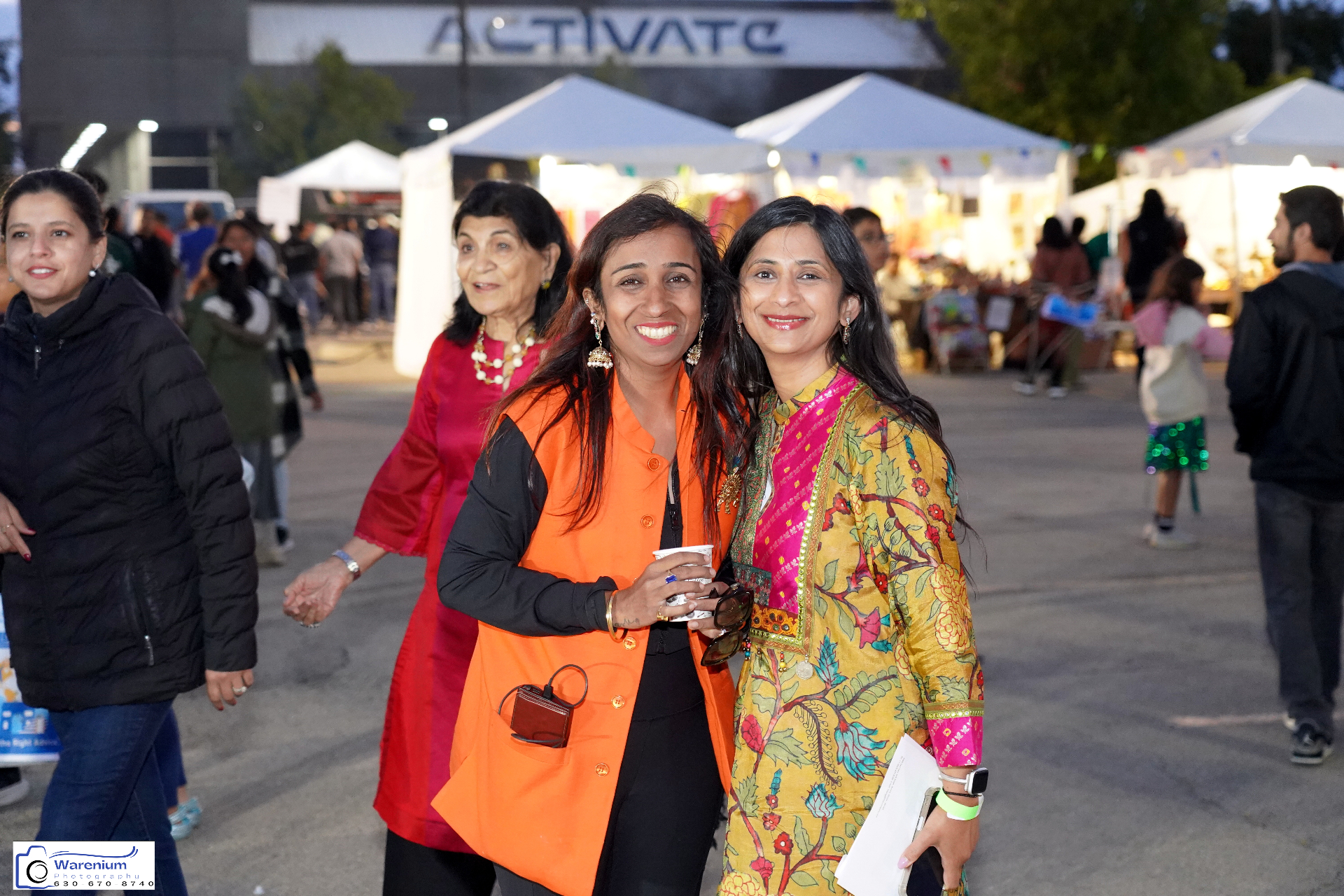Attendees enjoying the evening at the festival bazaar