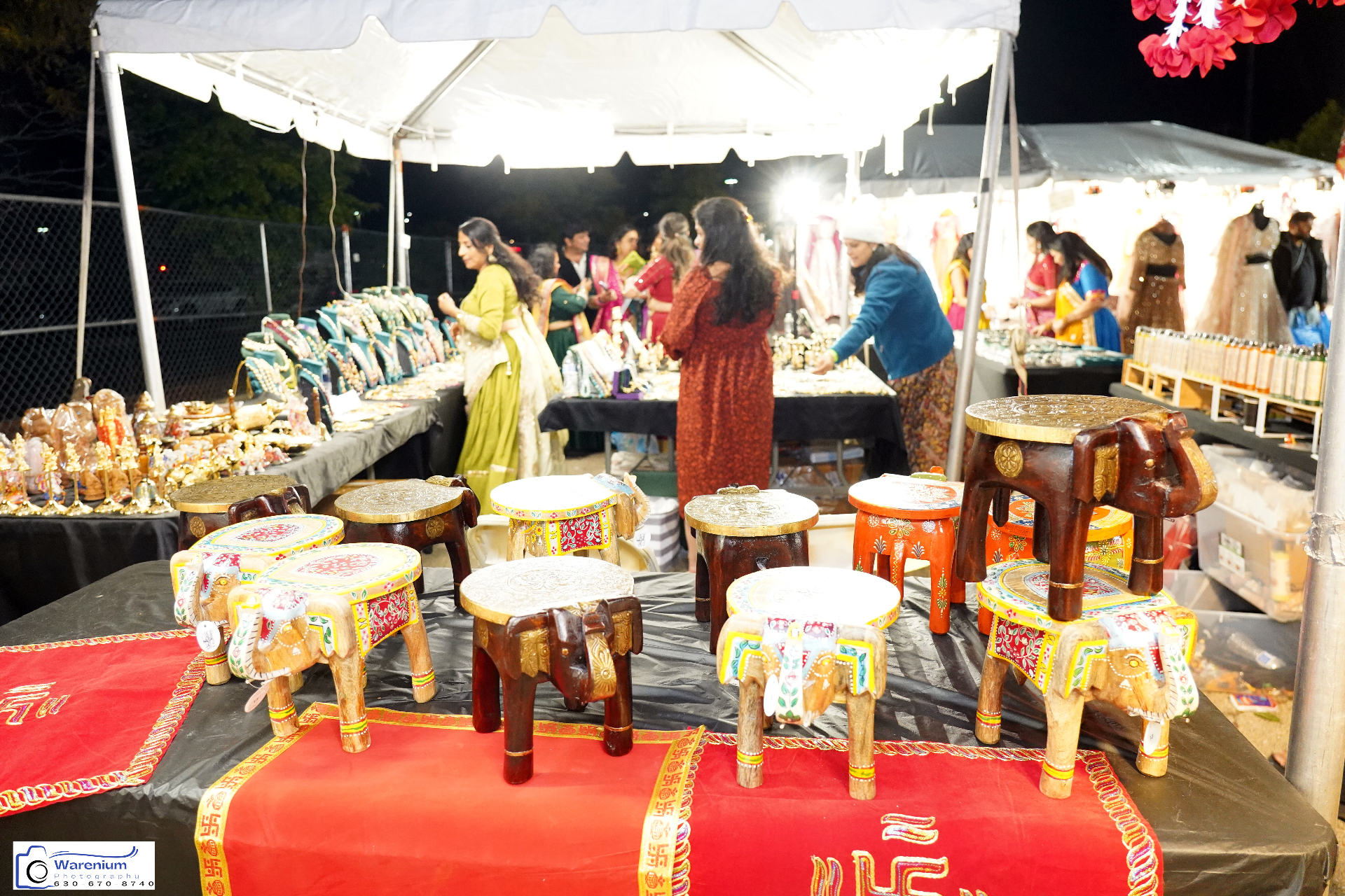 Handcrafted painted stools and decor displayed at a Day 4 crafts stall