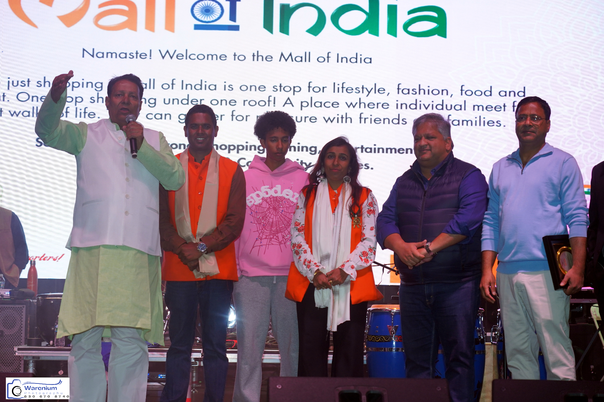 Day 4 guests welcomed on stage in front of the Mall of India screen